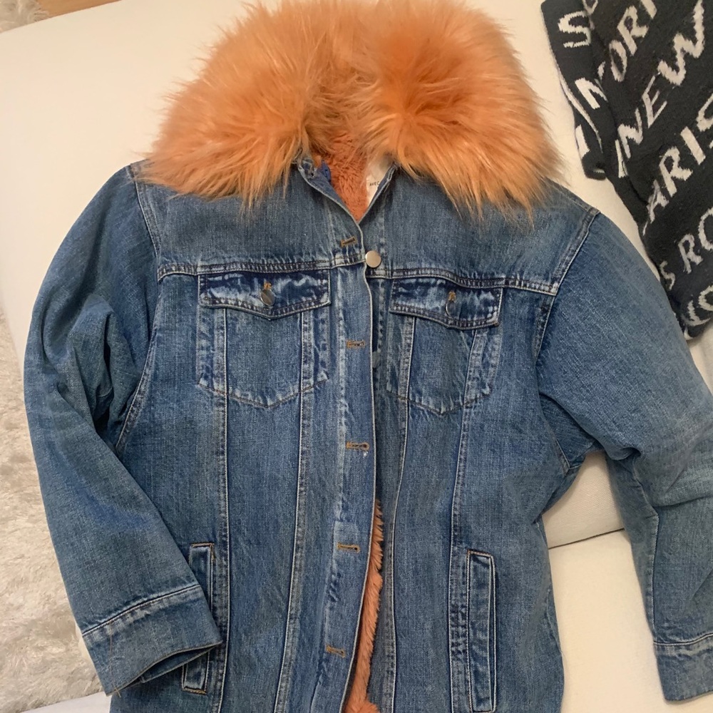 Denim jacket with pink faux fur